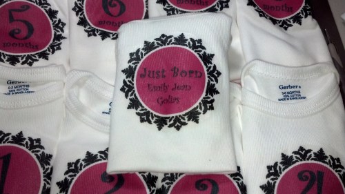 Here's a close up the of onesies and the keepsake one.